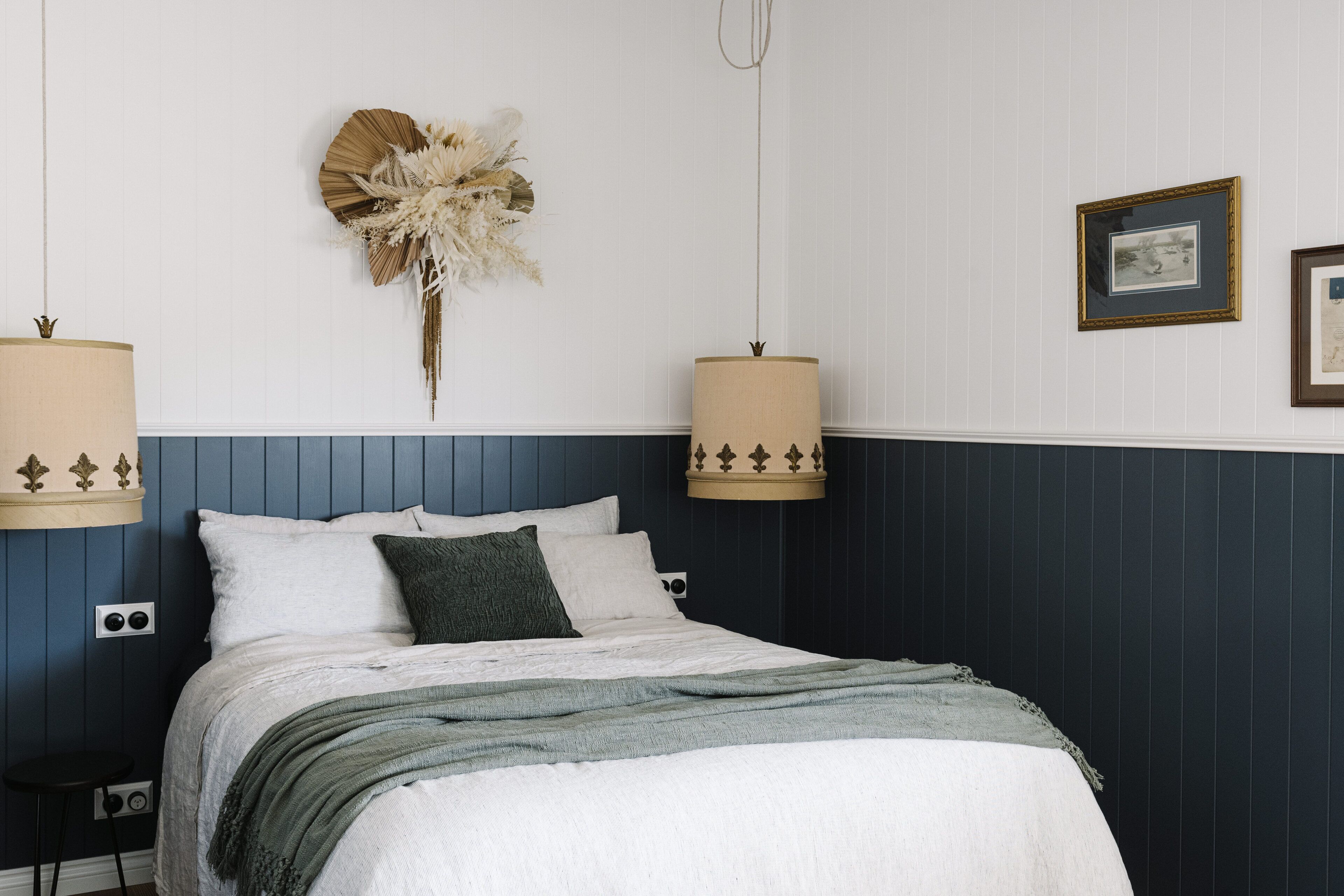 Master bedroom with luxurious linen bedding and epic vintage light shades