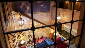 A lounge area with a high ceiling, ornate lanterns, and a seating area with cushions. - Ala Han Boutique Hotel (Sanliurfa)