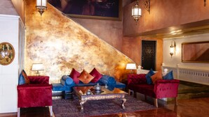 A luxurious lobby with a grand staircase, plush seating, and ornate decor. - Ala Han Boutique Hotel (Sanliurfa)