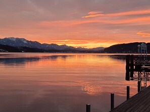 Enjoy serene lakeside views and a tranquil atmosphere from the comfort of a picturesque dock.