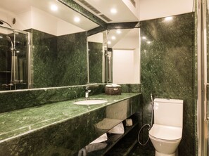 Shower, towels, soap, toilet paper