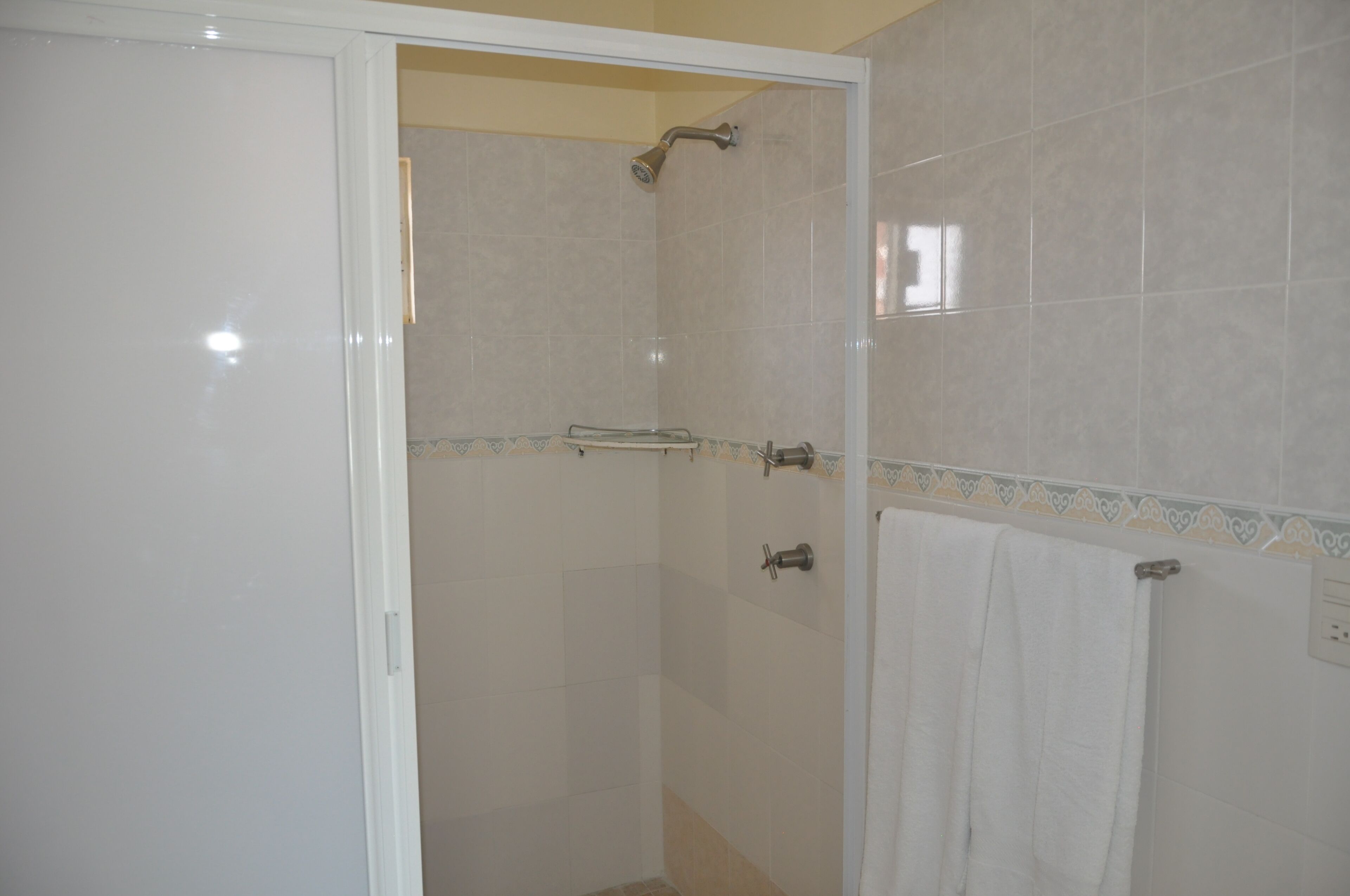standard room | bathroom | shower, rainfall showerhead, towels, soap