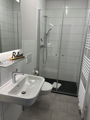 Shower, hair dryer, towels, soap