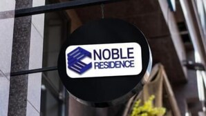 A sign for Noble Residence, featuring a logo with a blue and white design. - Noble Residence (Seoul)
