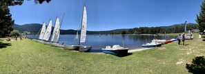 Enjoy serene lakeside views and picturesque sailboats docked along the shore.