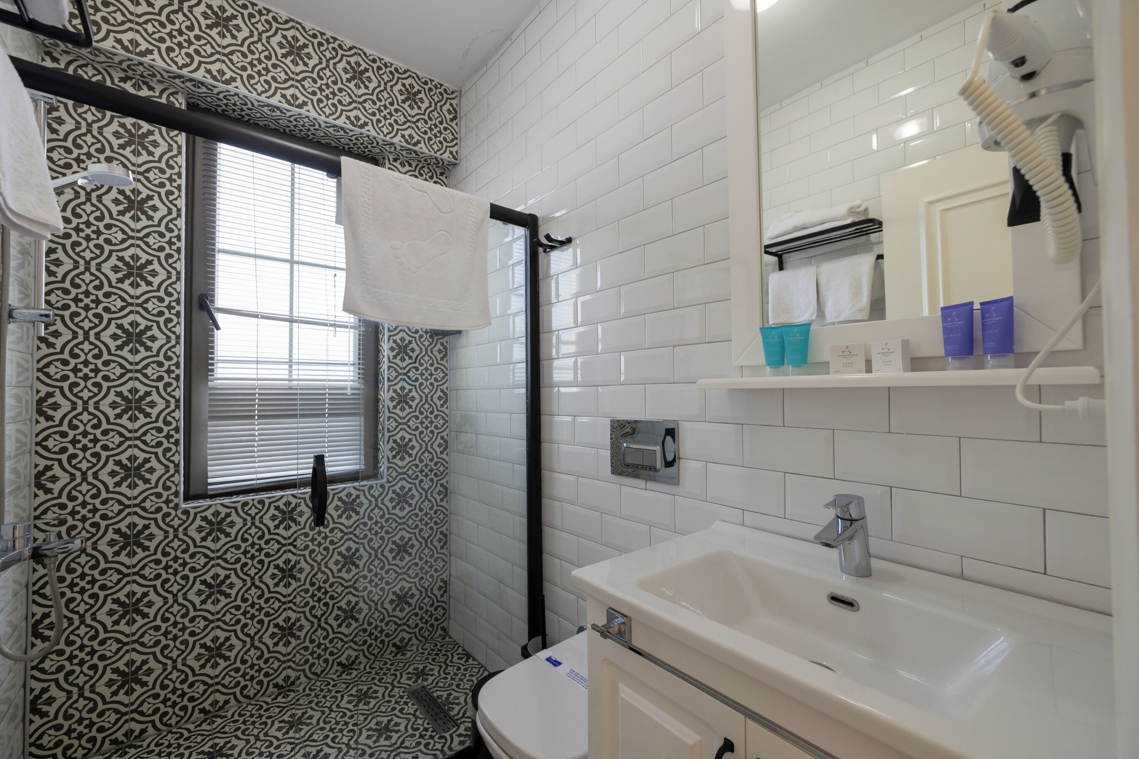 deluxe double room, balcony | bathroom | shower, hair dryer, towels, soap