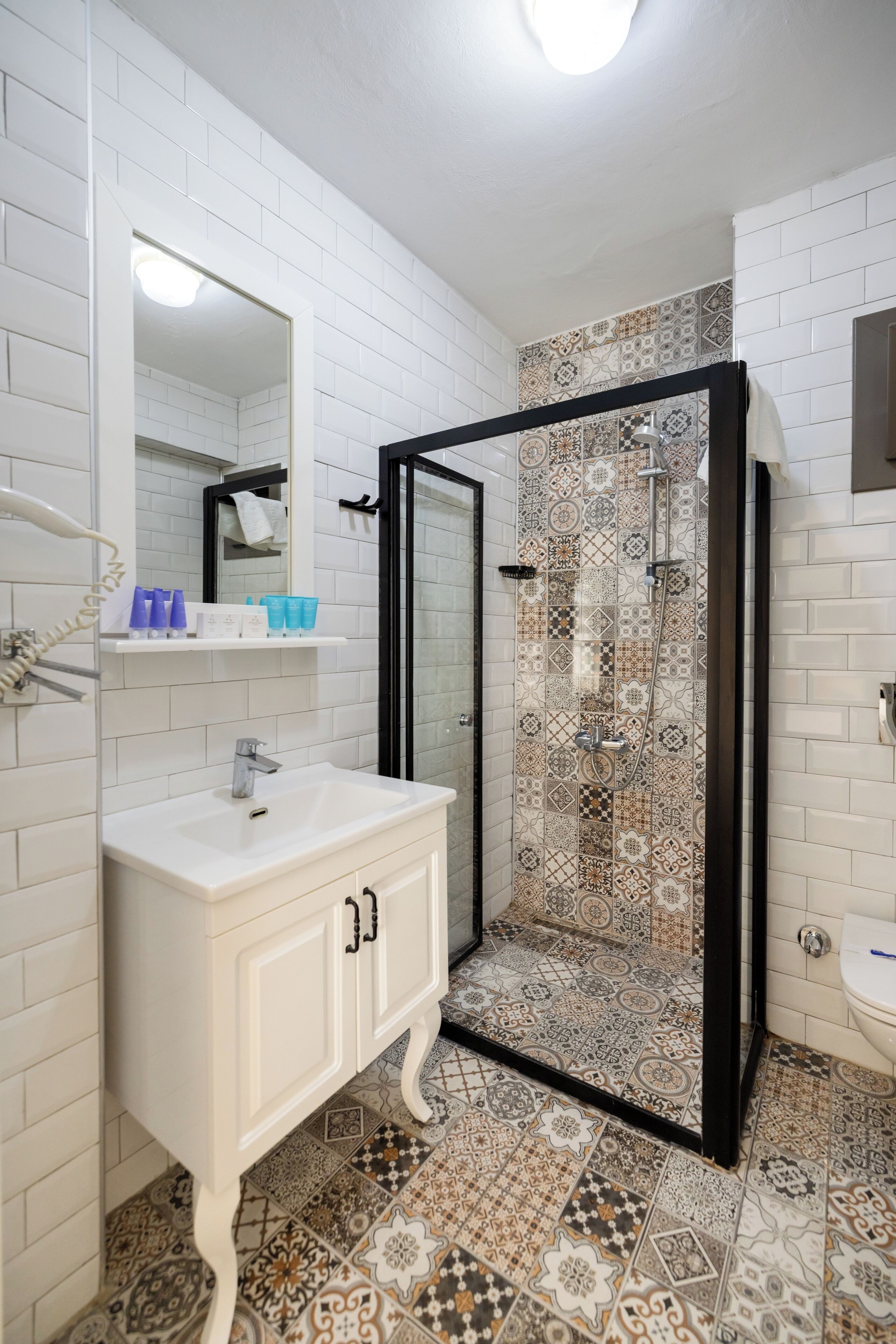 deluxe triple room, patio | bathroom | shower, hair dryer, towels, soap