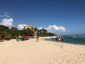 On the beach, sun loungers, beach towels
