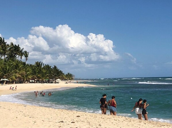 On the beach, sun loungers, beach towels