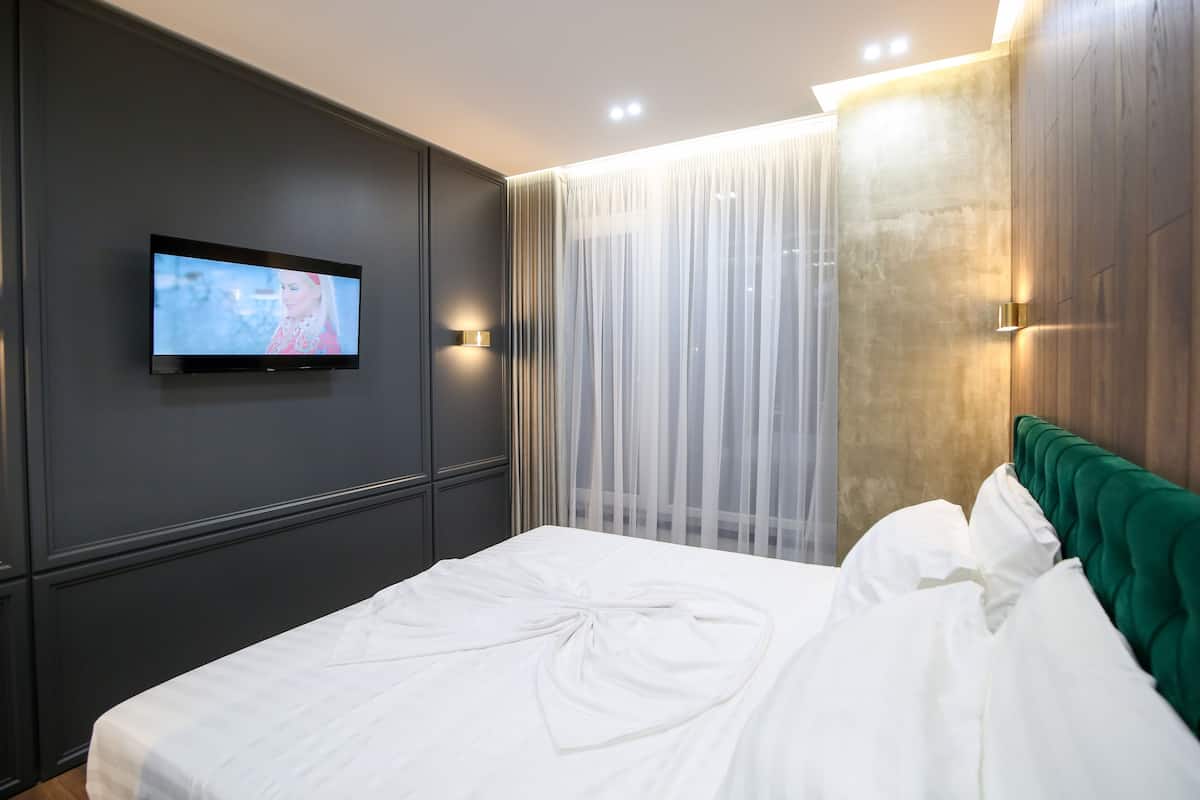 Habitación doble Deluxe, vista al mar | Ropa de cama de alta calidad y minibar