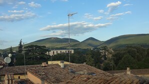 A rooftop with terracotta tiles, a satellite dish, and a tall antenna. - Hotel La Torretta (Foligno)