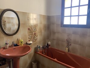 Bathtub, hair dryer, towels, soap