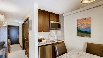 Fridge, microwave, stovetop, coffee/tea maker