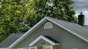 A single-story building with a gabled roof, a front door, and a mailbox. - WELCOME!  Are you looking to get away, to disconnect and relax? Look no further. (Montello)