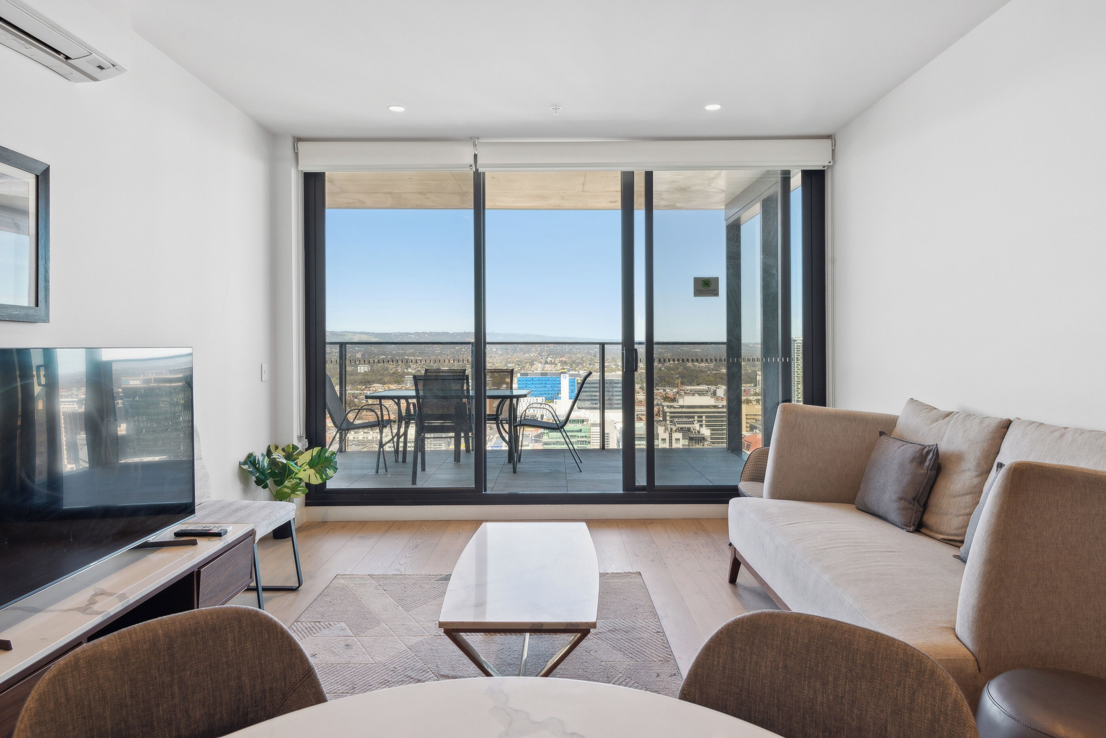 Three Bedroom Two Bathroom Apartment | Living area | 55-inch flat-screen TV with digital channels, TV