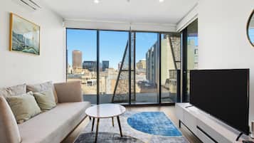 Two Bedroom Two Bathroom Apartment | Living area | 55-inch flat-screen TV with digital channels, TV