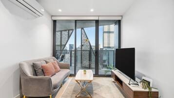 Two Bedroom One Bathroom Apartment | Living area | 55-inch flat-screen TV with digital channels, TV