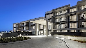 A modern hotel with a spacious entrance, multiple floors, and a well-lit facade. - Quest Ballarat Station (Soldiers Hill)