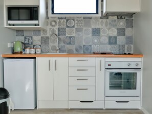 Fridge, microwave, toaster, cookware/dishes/utensils