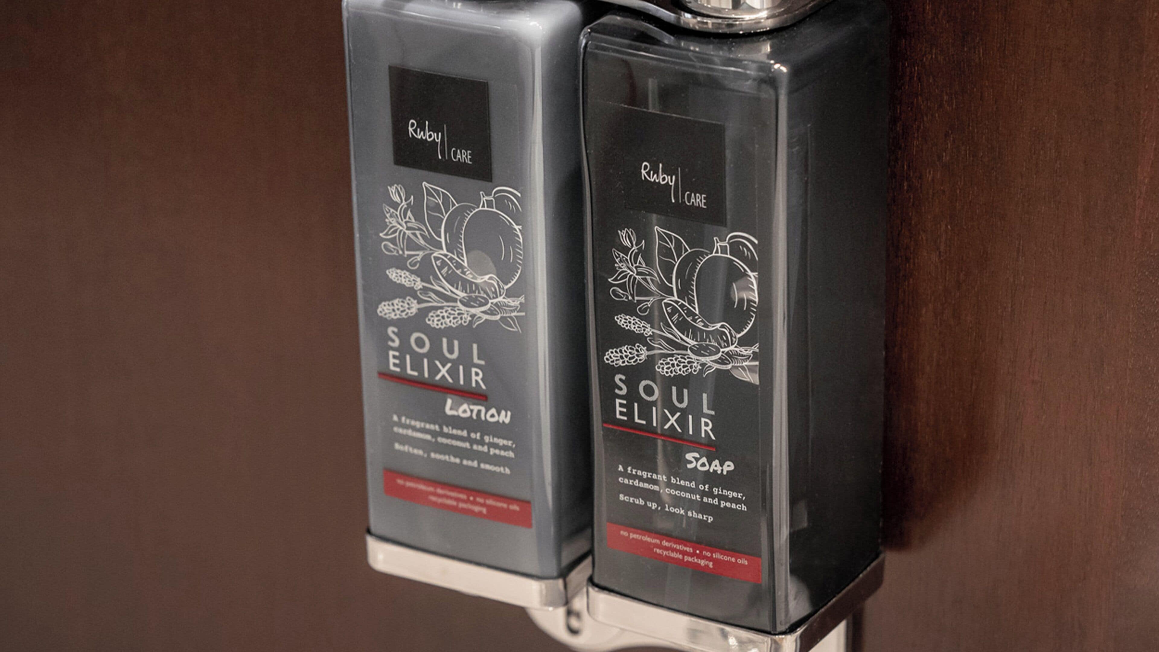 Two dispensers of Soul Elixir soap with a ginger and coconut scent.