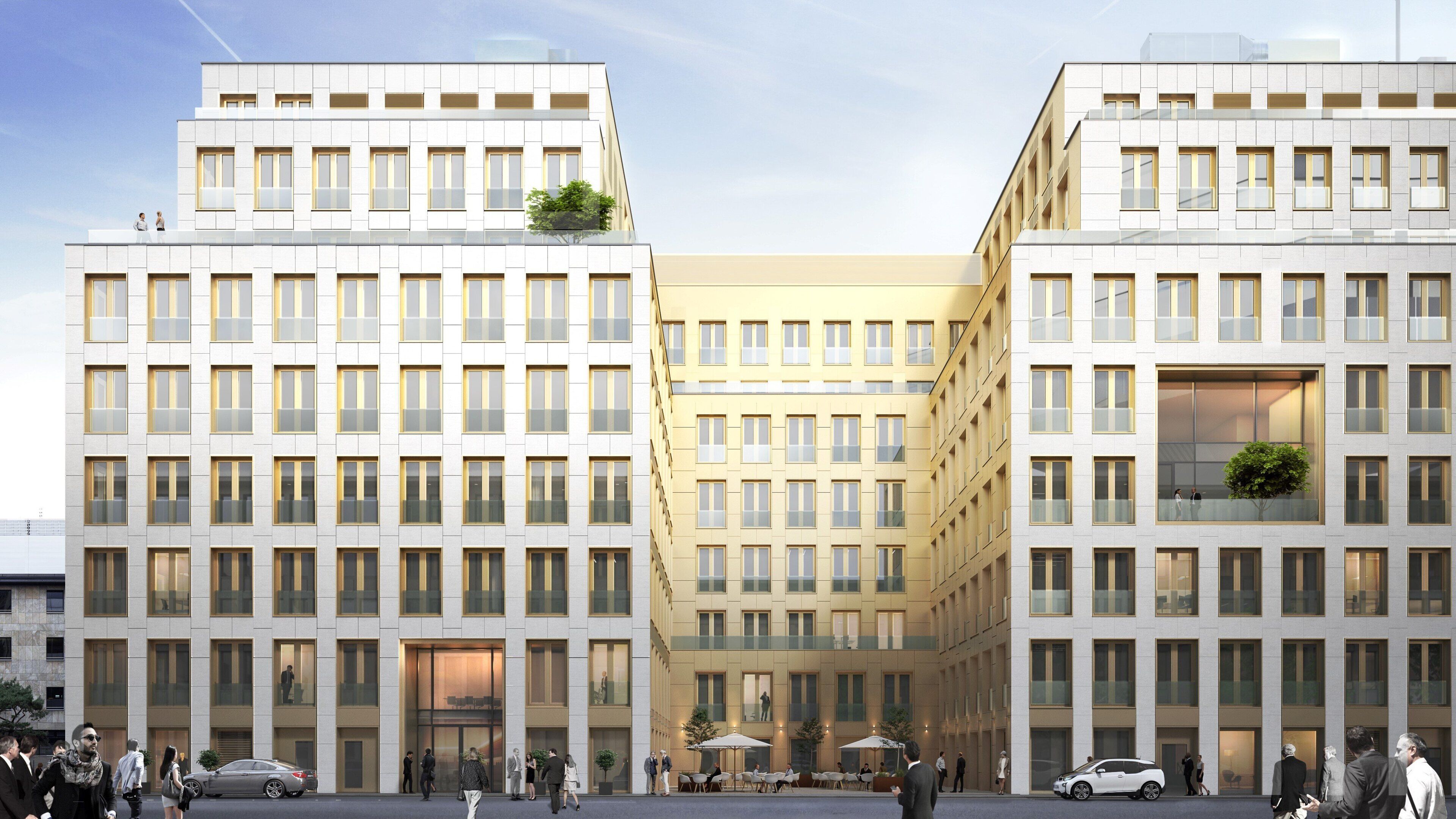 A modern building with multiple floors, large windows, and a central courtyard.