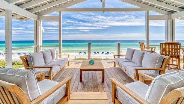 A covered outdoor seating area with a view of the beach and ocean. - Gulf Front in the Middle of Seaside! Elevator, Community Pools, Bikes, and More (Santa Rosa Beach)