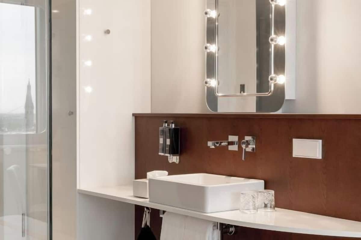 Shower, rainfall showerhead, designer toiletries, hair dryer