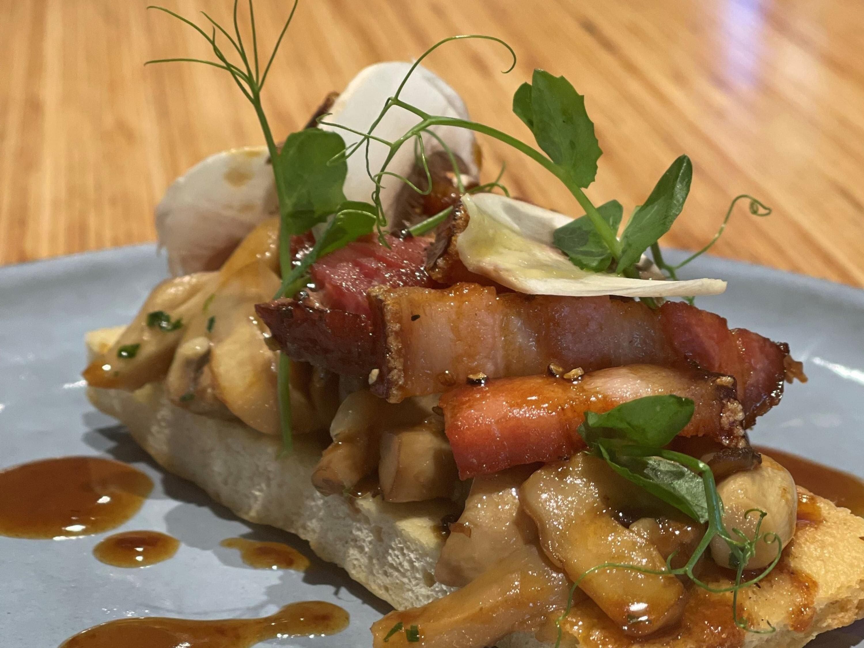 A dish with various ingredients on a plate.