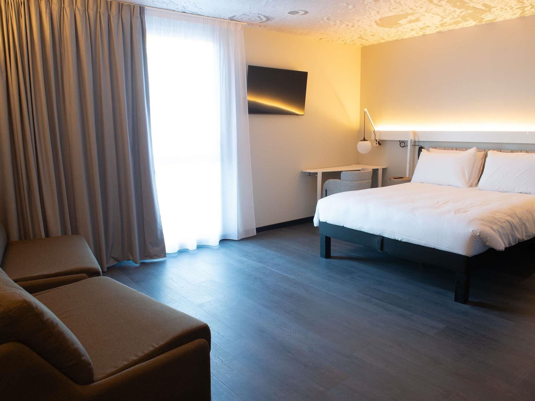 Deluxe Room, Multiple Beds | Individually furnished, desk, laptop workspace, blackout curtains