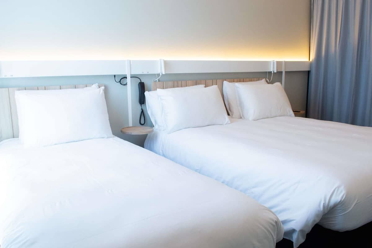 Deluxe Room, Multiple Beds | Individually furnished, desk, laptop workspace, blackout drapes