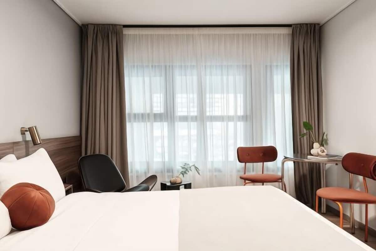 Minibar, blackout curtains, soundproofing, iron/ironing board