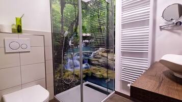 Shower, hair dryer, towels, toilet paper