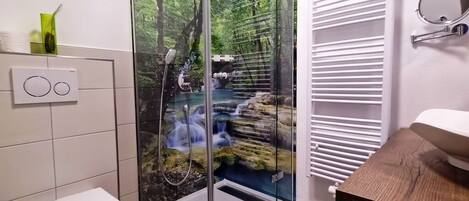 Shower, hair dryer, towels, toilet paper