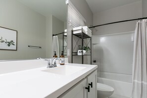 Bathtub, hair dryer, towels