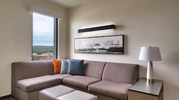 Premium bedding, desk, laptop workspace, blackout drapes