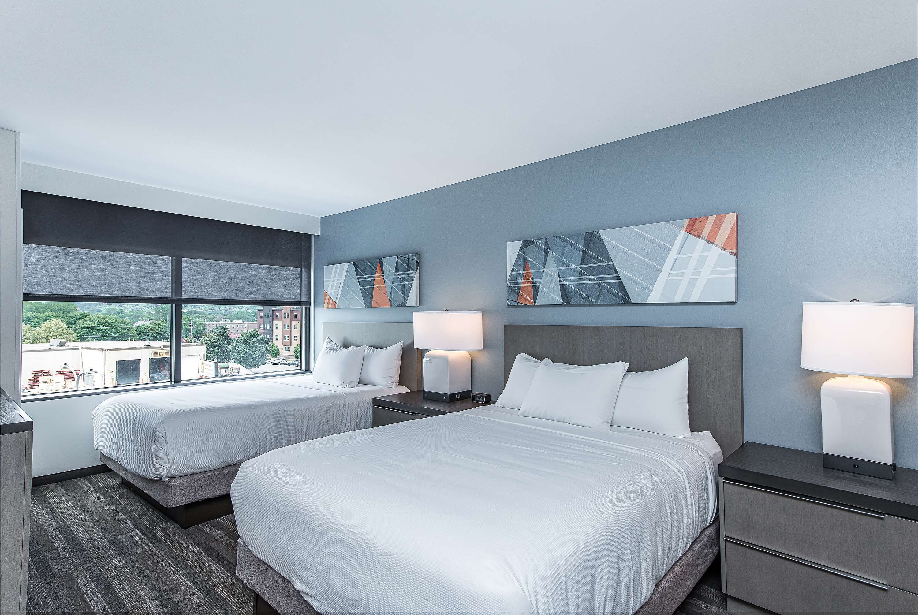 Premium bedding, desk, laptop workspace, blackout curtains