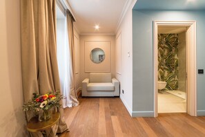 Junior Suite | Living area | 24-inch Smart TV with satellite channels, TV