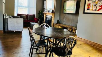 Luxury Cottage | Living area | 32-inch Smart TV with digital channels, TV, streaming services