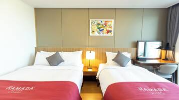 A hotel room with two beds, a desk, a chair, a lamp, and a painting on the wall.