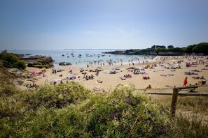 On the beach, sun-loungers