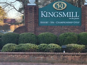 A sign for Kingsmill Resort, featuring amenities like a spa and championship golf. - Water-view in Kingsmill, 10 minutes to Busch Gardens & Colonial Williamsburg! (Williamsburg)
