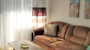 Apartment, 1 Bedroom (32m²) | Living room | Flat-screen TV