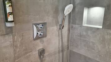 Shower, eco-friendly toiletries, hair dryer, towels