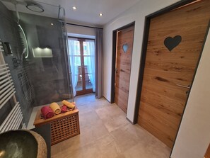 Shower, eco-friendly toiletries, hair dryer, towels