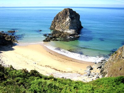 Lovely home with ocean views just a 5 minute walk to stunning beaches!
