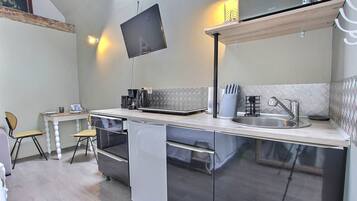 Fridge, microwave, coffee/tea maker, toaster