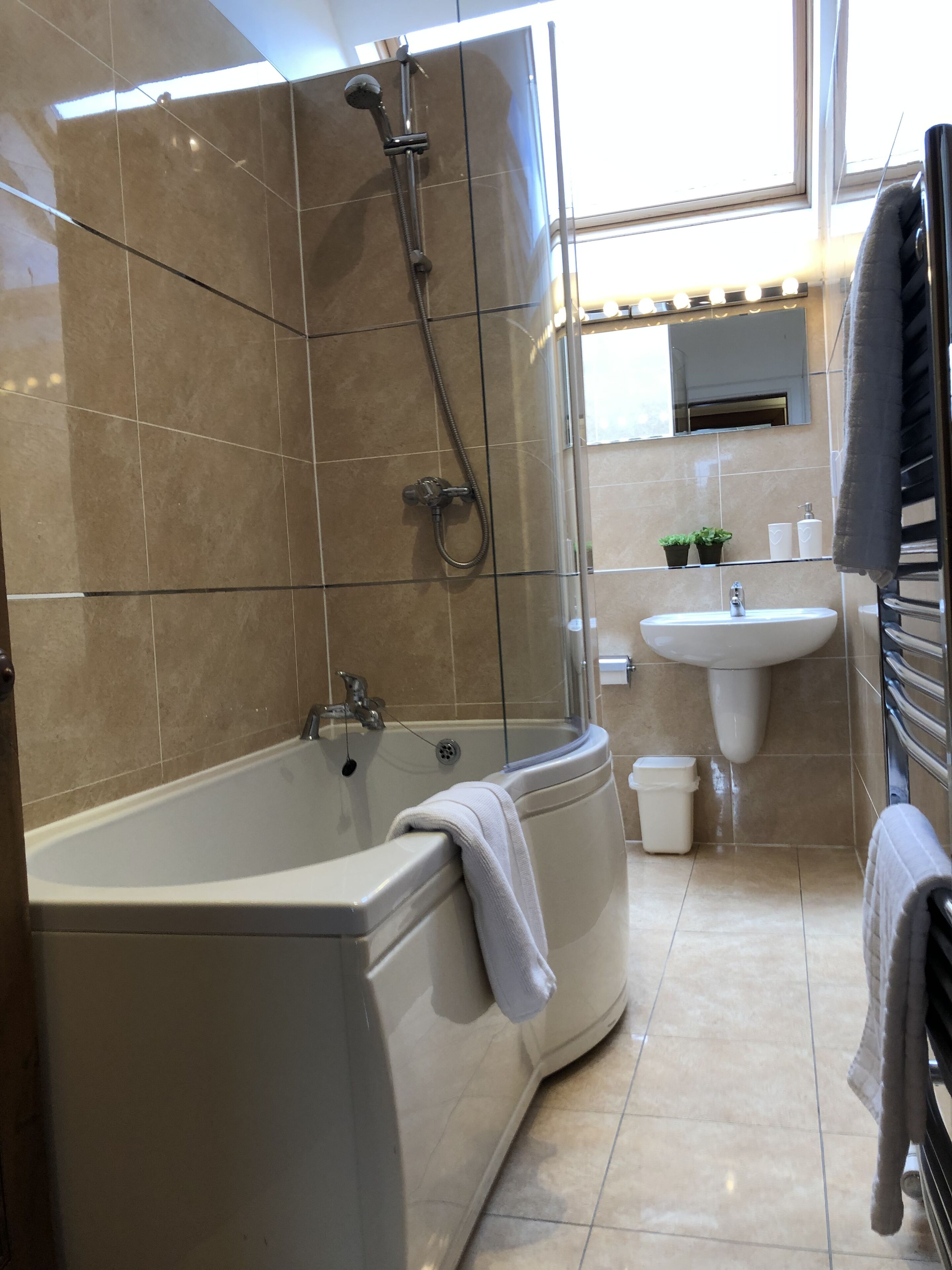 Combined shower/tub, hair dryer, towels, soap