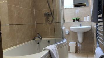 Combined shower/tub, hair dryer, towels, soap