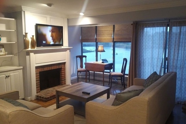 Living room with cozy sitting area/working area overlooking relaxing views.