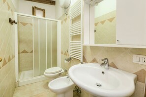 Shower, hair dryer, towels, toilet paper